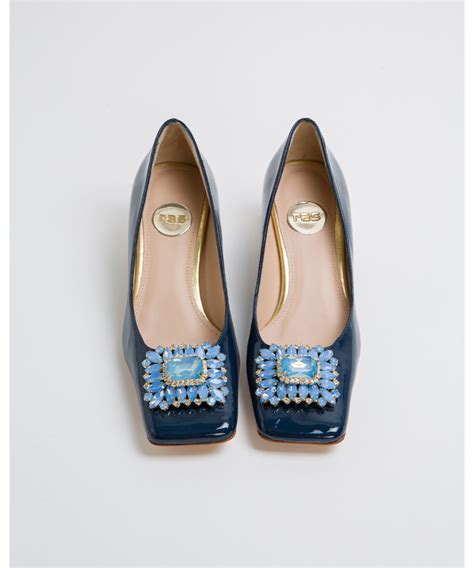 navy patent pumps